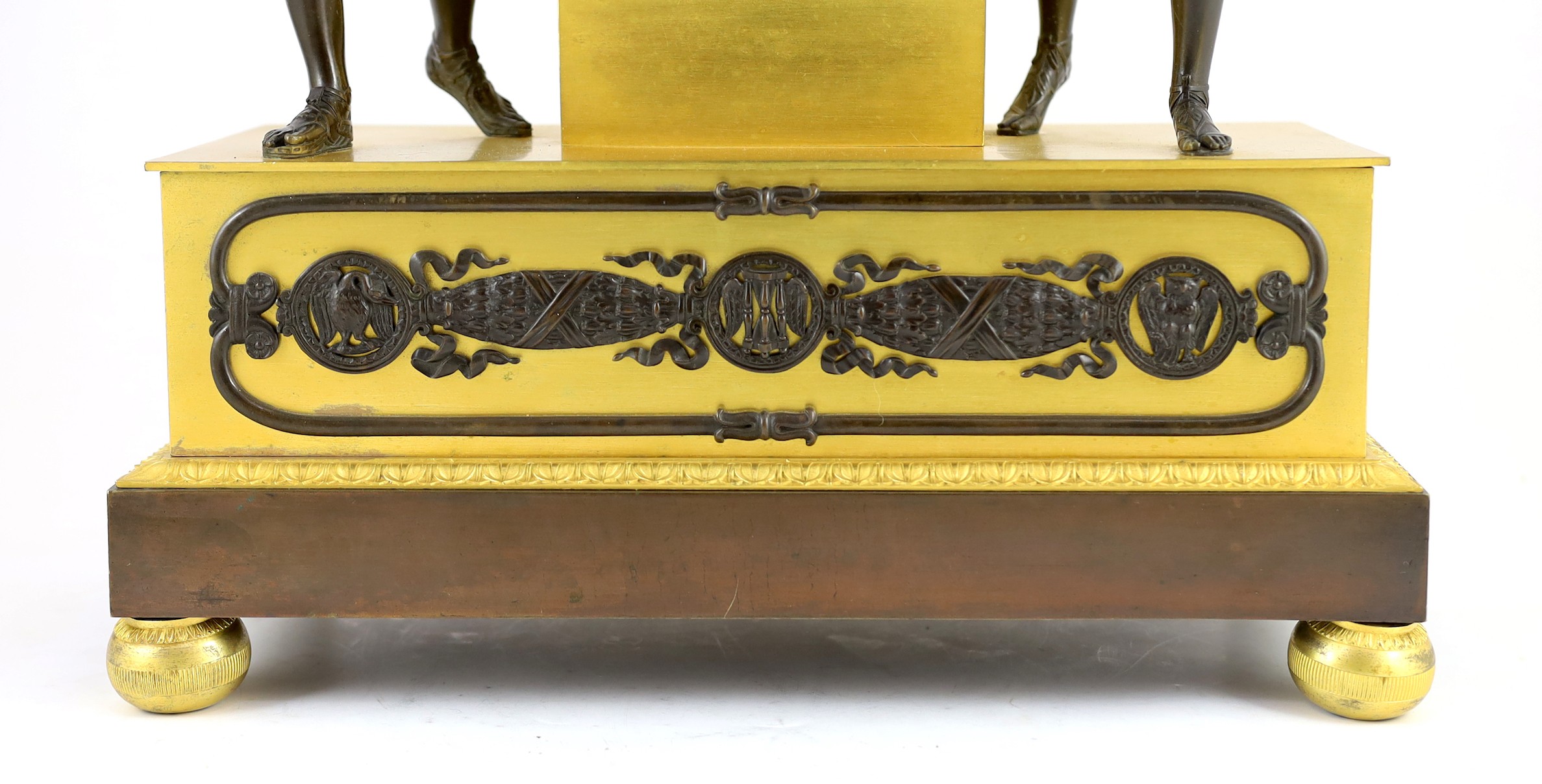 A 19th century French Louis XVI style bronze and ormolu mantel clock, width 42cm height 60cm